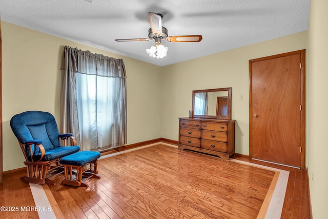 1914 Oak Dale Rd, Toms River, NJ 08753 - living area featuring light wood-style flooring, a textured ceiling, and ceiling fan