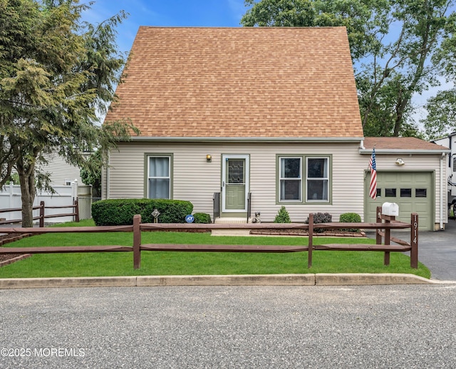 1914 Oak Dale Rd, Toms River, NJ 08753 - cape cod house featuring an attached garage, a fenced front yard, roof with shingles, and driveway