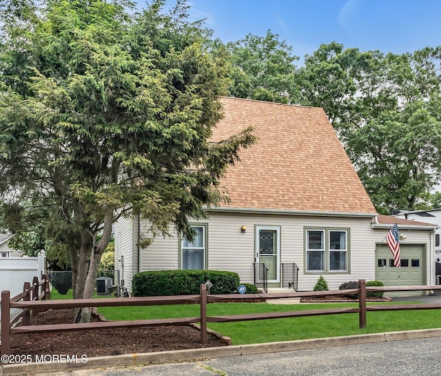 1914 Oak Dale Rd, Toms River, NJ 08753 - new england style home with a garage, a shingled roof, and a fenced front yard