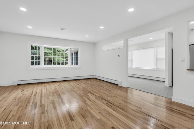 925 Edgebrook Dr N, Toms River, NJ 08757 - spare room featuring light wood-style floors, baseboard heating, a baseboard heating unit, and recessed lighting