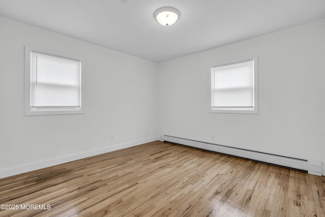 925 Edgebrook Dr N, Toms River, NJ 08757 - empty room featuring a baseboard heating unit and light wood finished floors