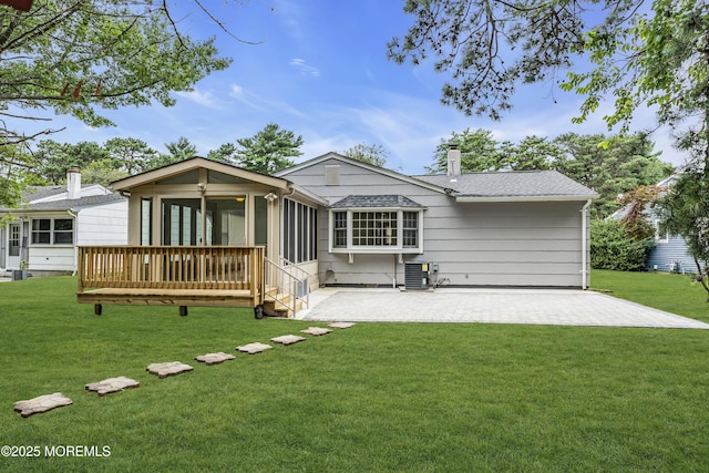 925 Edgebrook Dr N, Toms River, NJ 08757 - rear view of house featuring a patio area, a yard, a sunroom, and a shingled roof