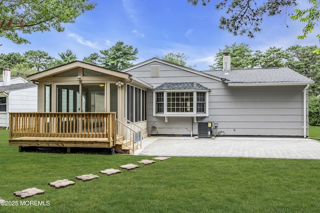 925 Edgebrook Dr N, Toms River, NJ 08757 - back of house featuring roof with shingles, a sunroom, a chimney, a yard, and a patio