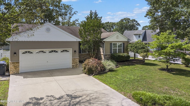 1587 Fort St, Brick, NJ 08724 - view of front of house with stone siding, concrete driveway, a garage, and a front lawn