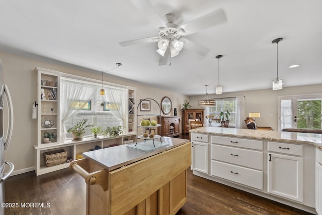 1587 Fort St, Brick, NJ 08724 - kitchen with ceiling fan, white cabinetry, a center island, pendant lighting, and light stone counters