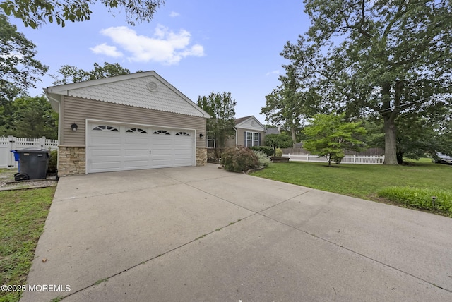 1587 Fort St, Brick, NJ 08724 - ranch-style house with stone siding, concrete driveway, and an outbuilding