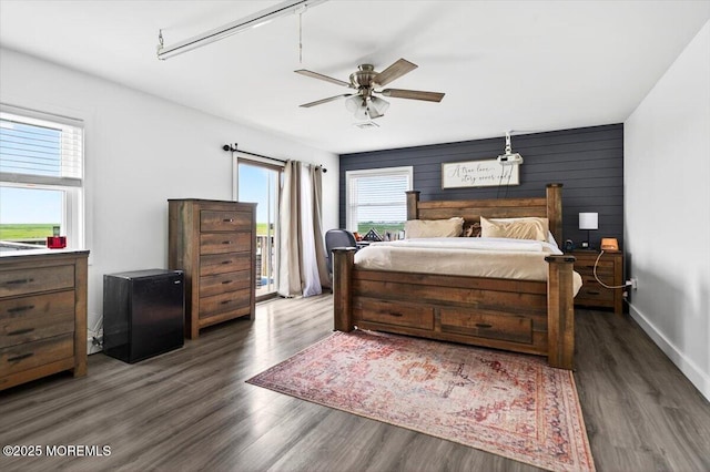 322 Dock Rd, West Creek, NJ 08092 - bedroom with multiple windows, wood finished floors, access to outside, and ceiling fan