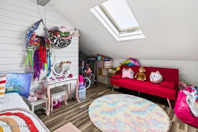 322 Dock Rd, West Creek, NJ 08092 - bedroom featuring lofted ceiling, a skylight, wood walls, and wood finished floors