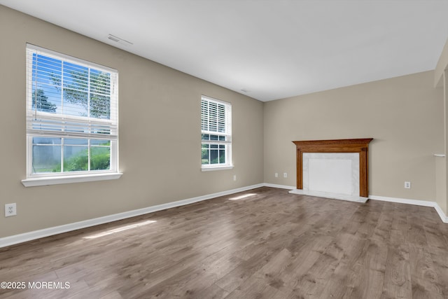 971 Center St, Little Egg Harbor, NJ 08087 - unfurnished living room featuring plenty of natural light, wood finished floors, and a fireplace