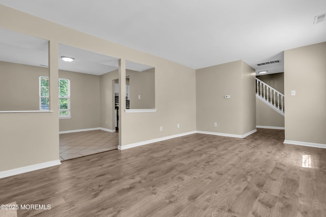 971 Center St, Little Egg Harbor, NJ 08087 - unfurnished living room featuring wood finished floors and stairs