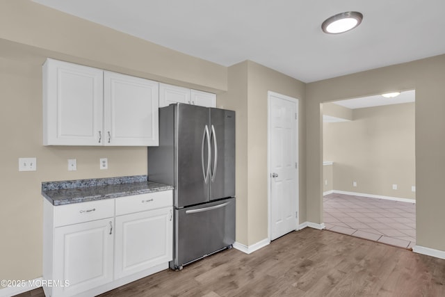 971 Center St, Little Egg Harbor, NJ 08087 - kitchen with freestanding refrigerator, white cabinetry, and light wood-style flooring