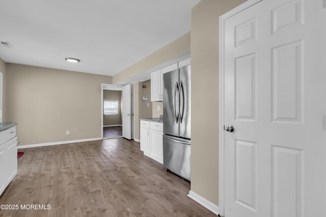 971 Center St, Little Egg Harbor, NJ 08087 - kitchen featuring freestanding refrigerator, white cabinetry, and wood finished floors