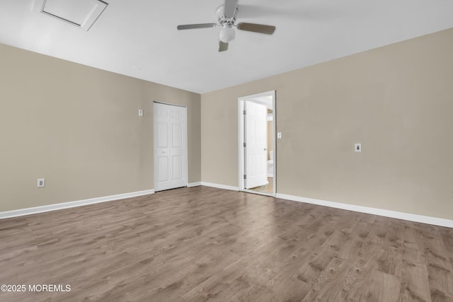 971 Center St, Little Egg Harbor, NJ 08087 - empty room with ceiling fan, wood finished floors, and attic access