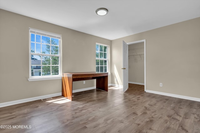 971 Center St, Little Egg Harbor, NJ 08087 - empty room featuring plenty of natural light, wood finished floors, and a desk