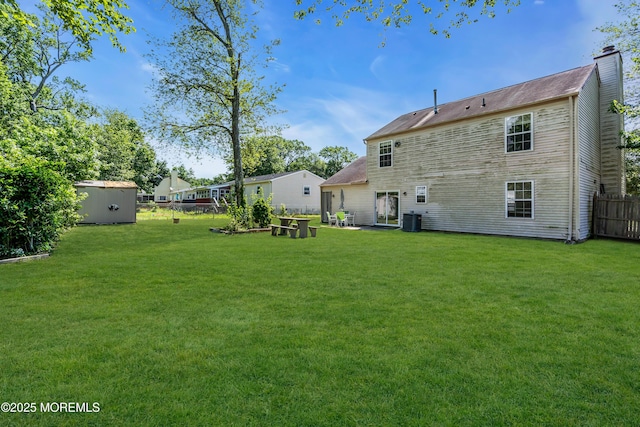 971 Center St, Little Egg Harbor, NJ 08087 - rear view of property featuring a chimney and a shed