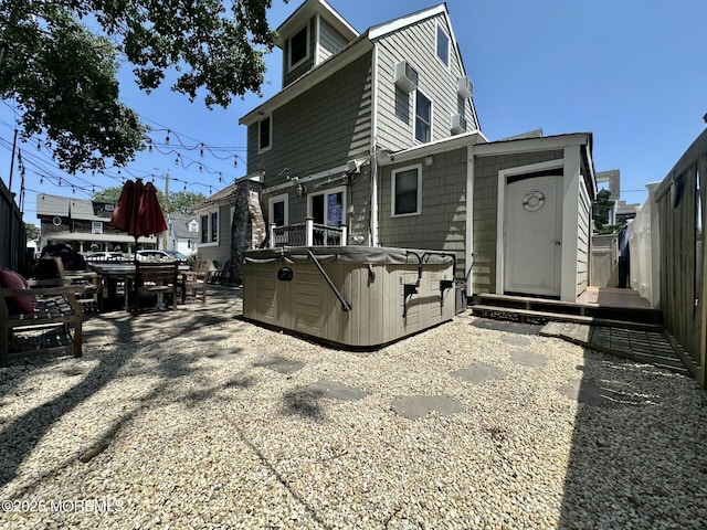 224 5th St Unit A, Beach Haven, NJ 08008 - rear view of house featuring a hot tub, a patio area, and a shed