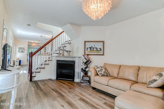 132 Heck Ave, Ocean Grove, NJ 07756 - living room with a chandelier, stairs, and wood finished floors