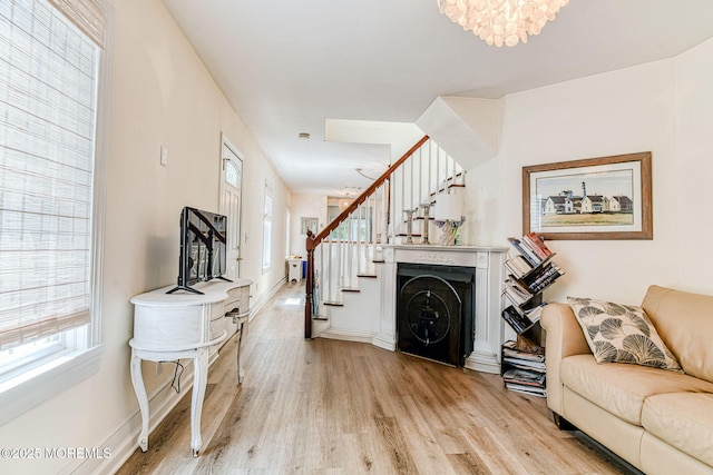132 Heck Ave, Ocean Grove, NJ 07756 - living area with stairway, light wood-type flooring, and plenty of natural light