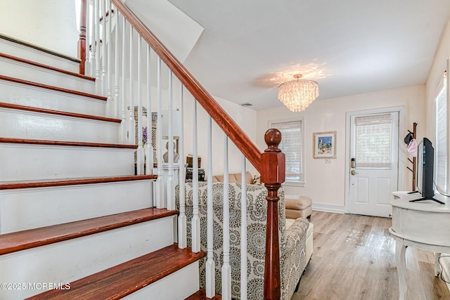 132 Heck Ave, Ocean Grove, NJ 07756 - stairs with wood finished floors and a chandelier
