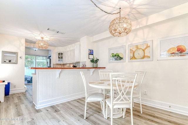 132 Heck Ave, Ocean Grove, NJ 07756 - dining room featuring a chandelier and light wood-type flooring