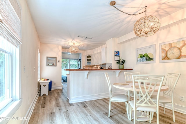 132 Heck Ave, Ocean Grove, NJ 07756 - dining space featuring light wood finished floors and a chandelier