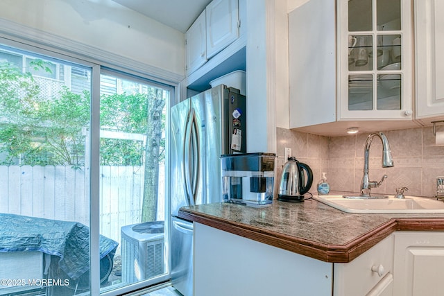 132 Heck Ave, Ocean Grove, NJ 07756 - kitchen with white cabinetry, tasteful backsplash, and glass insert cabinets