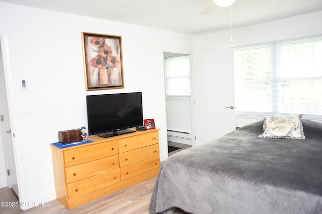 8B Cambridge Cir, Manchester, NJ 08759 - bedroom featuring light wood-style flooring and baseboard heating
