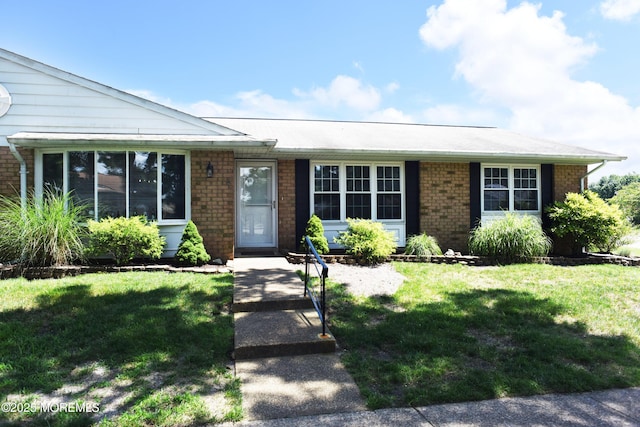 8B Cambridge Cir, Manchester, NJ 08759 - single story home with a front lawn and brick siding