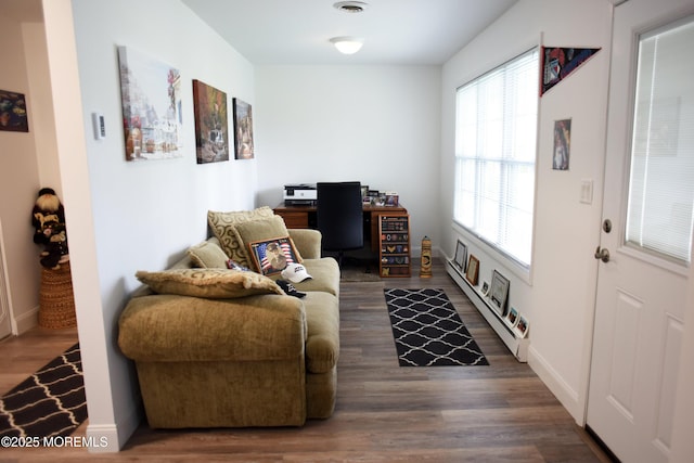 8B Cambridge Cir, Manchester, NJ 08759 - living area featuring wood finished floors, a baseboard radiator, and a desk