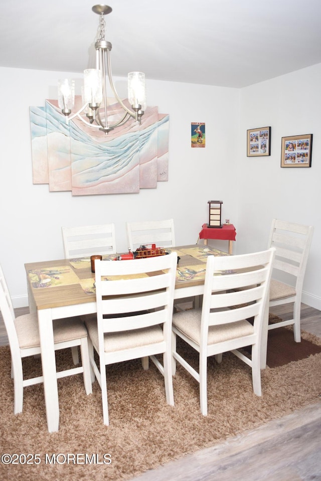 8B Cambridge Cir, Manchester, NJ 08759 - dining area featuring wood finished floors and a chandelier