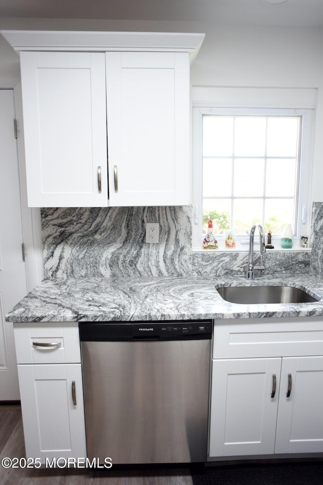8B Cambridge Cir, Manchester, NJ 08759 - kitchen with stainless steel dishwasher, white cabinets, and light stone counters