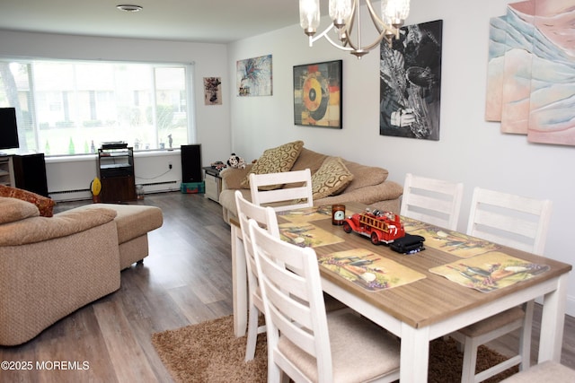 8B Cambridge Cir, Manchester, NJ 08759 - dining room featuring baseboard heating, a chandelier, a baseboard heating unit, and wood finished floors