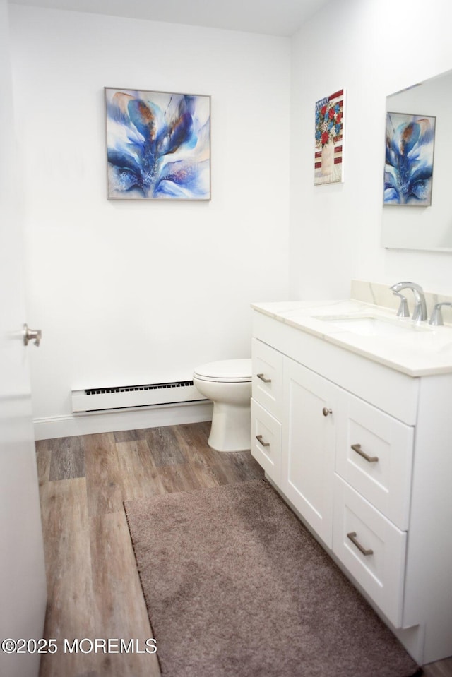 8B Cambridge Cir, Manchester, NJ 08759 - bathroom with a baseboard heating unit, vanity, and wood finished floors