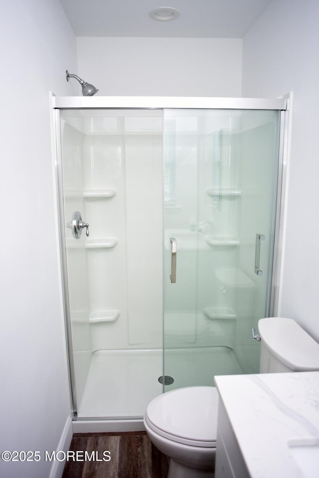 8B Cambridge Cir, Manchester, NJ 08759 - bathroom with wood finished floors, a stall shower, and vanity