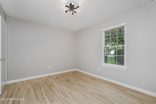 701 Zlotkin Cir Unit 1, Freehold, NJ 07728 - spare room featuring light wood finished floors and a chandelier