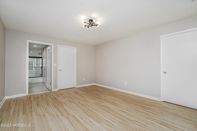 701 Zlotkin Cir Unit 1, Freehold, NJ 07728 - spare room featuring light wood-style flooring and baseboards