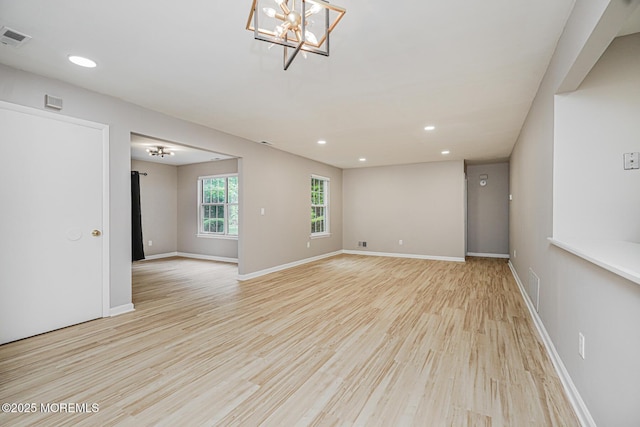 701 Zlotkin Cir Unit 1, Freehold, NJ 07728 - empty room with light wood finished floors, recessed lighting, and a chandelier