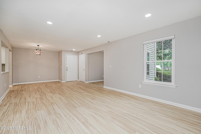 701 Zlotkin Cir Unit 1, Freehold, NJ 07728 - spare room with a chandelier, light wood-type flooring, and recessed lighting