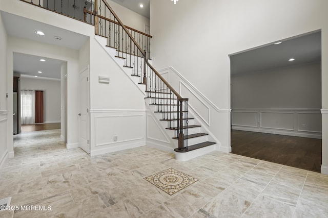29 Lorton Rd, Old Bridge, NJ 08857 - staircase with a decorative wall, a towering ceiling, recessed lighting, and a wainscoted wall