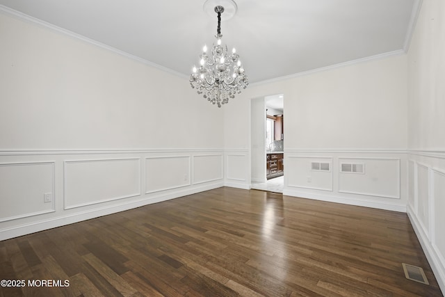 29 Lorton Rd, Old Bridge, NJ 08857 - unfurnished dining area with a chandelier, a decorative wall, crown molding, wood finished floors, and a wainscoted wall