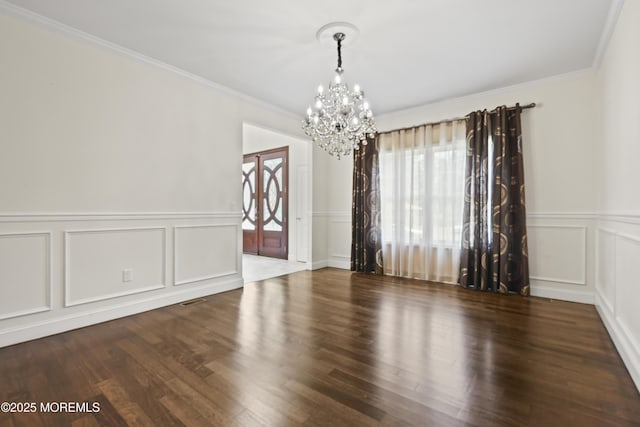 29 Lorton Rd, Old Bridge, NJ 08857 - spare room with a chandelier, a decorative wall, ornamental molding, wainscoting, and wood finished floors