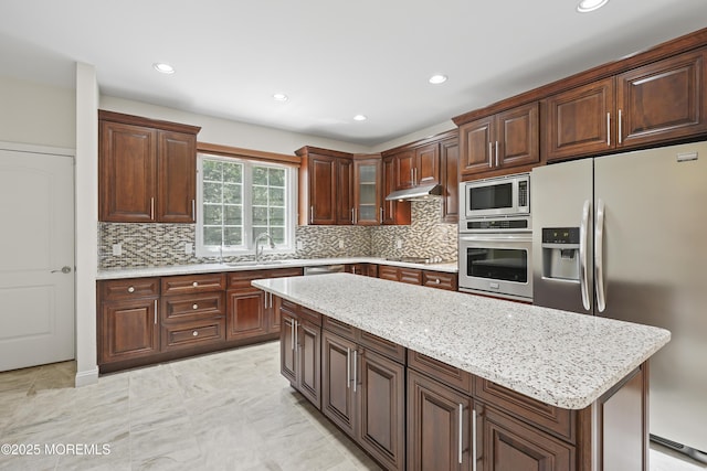 29 Lorton Rd, Old Bridge, NJ 08857 - kitchen with stainless steel appliances, under cabinet range hood, tasteful backsplash, recessed lighting, and light stone countertops