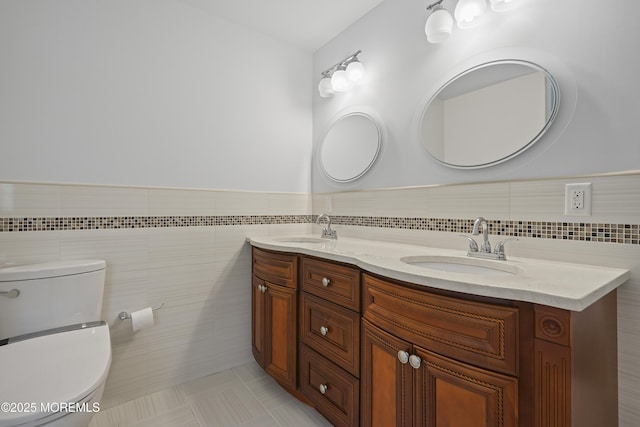 29 Lorton Rd, Old Bridge, NJ 08857 - bathroom featuring tile walls, double vanity, wainscoting, and tile patterned flooring