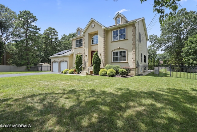 29 Lorton Rd, Old Bridge, NJ 08857 - view of front facade featuring driveway, roof mounted solar panels, stucco siding, and an attached garage
