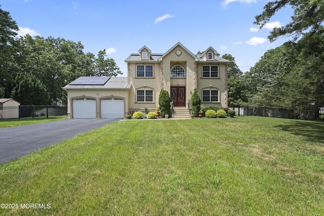29 Lorton Rd, Old Bridge, NJ 08857 - view of front of home featuring driveway, a garage, solar panels, and stucco siding