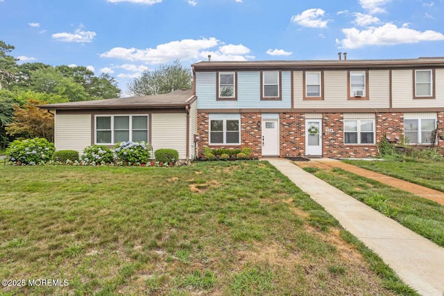 256 Greenwood Loop Rd, Brick, NJ 08724 - colonial inspired home with a front lawn, brick siding, and cooling unit