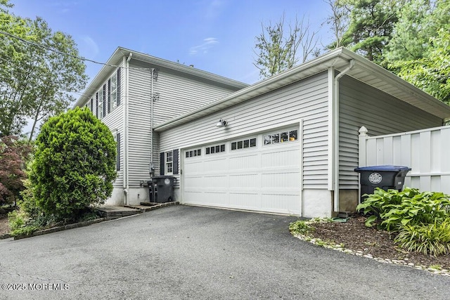 1207 Bayberry Rd, Manasquan, NJ 08736 - view of side of home featuring driveway and an attached garage