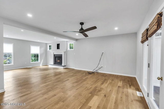 1207 Bayberry Rd, Manasquan, NJ 08736 - unfurnished living room with light wood-style floors, a glass covered fireplace, a ceiling fan, and recessed lighting