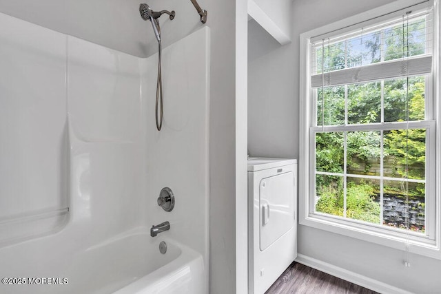 1207 Bayberry Rd, Manasquan, NJ 08736 - full bath featuring washer / clothes dryer, bathing tub / shower combination, and wood finished floors