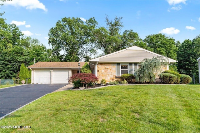 23 Spring St, Franklin Twp, NJ 08873 - view of front facade with asphalt driveway, a front lawn, stone siding, and a garage